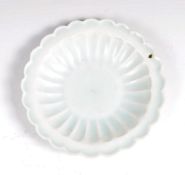 A BELIEVED ANTIQUE CHINESE SHIPWRECK CELADON PLATE