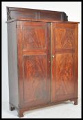 AN EARLY 19TH CENTURY FLAME MAHOGANY BOOKCASE CABI