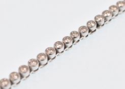 18CT WHITE GOLD AND DIAMOND LINE TENNIS BRACELET L