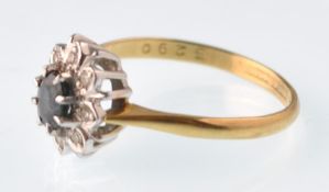 An 18ct gold sapphire and diamond oval cluster rin