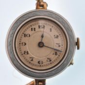 An early 20th century gold plated and enamel ladie