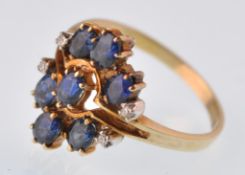 A modern 14ct gold sapphire and diamond cluster ri
