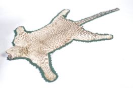 TAXIDERMY 19TH / 20TH CENTURY LEOPARD SKIN RUG ON FELT