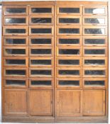 A PAIR OF LARGE MID 20TH CENTURY HABERDASHERY CABINETS
