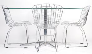 A CONTEMPORARY DINING SUITE IN THE MANNER OF HARRY BERTOIA