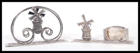 Two Dutch silver desk ornaments to include a lette