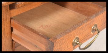 A mid century retro oak Air Ministry desk being ra