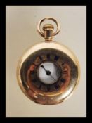 A late Victorian gold plated half hunter cased fob