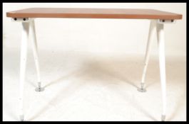 A 20th century desk, walnut top raised on angular