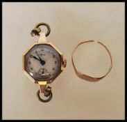 A hallmarked 9ct gold mid 20th Century Aviva wrist watch having a round face and hexagonal shape