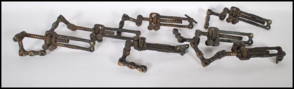 A group of seven (7) early 20th Century window catches by Cartland 'The Convertible' patented