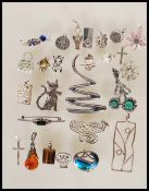 A selection of silver jewellery to include pendant and brooches, most being stamped 925 or marks