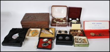 A collection of costume jewelry to include broches, earrings, necklace etc. Together with a
