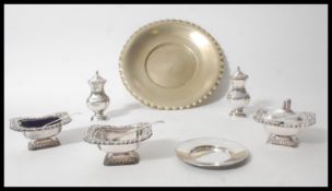 A silver plated rococo style table condiment set c