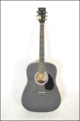 An ebonised 6 string Martin Smith full sized acous