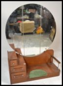 A 1950's Art Deco drop centre dressing table. Rais