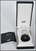 A Mont Blanc leather fob key chain with an enamelled Mont Blanc logo to the centre and lock to