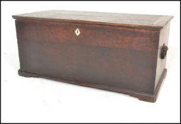 A 19th Century Georgian oak blanket box chest, hinged top with carry handles to the side, bone