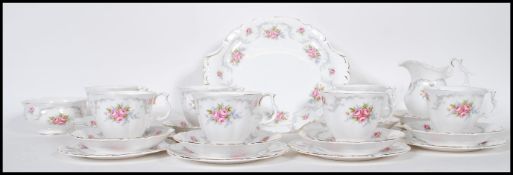A Royal Albert tea service in the Tranquillity pattern having floral and gray foliate decoration