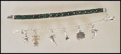 Two stamped 925 silver bracelets to include a spacer bracelet set with green stones ( measures 7
