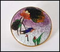 A vintage 20th Century Cloisonne enamelled brooch of round form depicting a kingfisher perched on