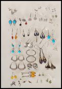 A collection of silver earrings to include drop earrings, stud earrings and hoop earrings, three