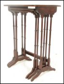 A late 19th Century Victorian mahogany nest of three tables having boxwood inlay decoration with