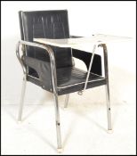 A vintage retro circa 1960's child's high chair, raised on chrome tubular base, vinyl upholstered