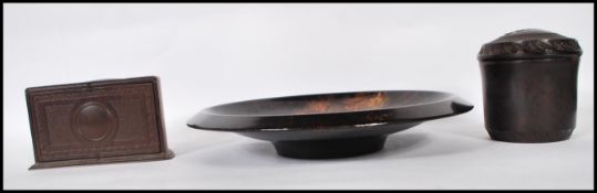 A group of three early 20th Century 1930's bakelite items to include a decorative demilune cigarette