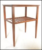 A retro 20th Century teak wood Danish inspired side / occasional table of square form, frieze top