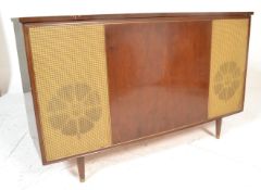A vintage retro 20th Century walnut cased radiogram by Bush, central walnut panel flanked by