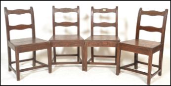A set of four 18th / 19th Century Georgian country oak peg jointed  dining chairs, rail back with