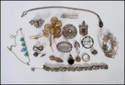 A collection of silver and silver white metal jewellery to include a an unengraved fob medal with an