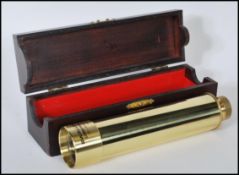 A contemporary Japanese made brass Swallow Commander 30 x 40 three draw telescope, in mahogany