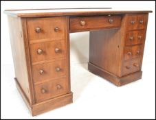 A Victorian 19th century solid mahogany twin pedestal office desk. Raised on plinth bases, each with