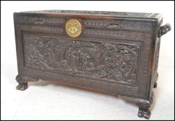 A good mid century 20th century Chinese camphor wood chest / trunk being carved in relief with