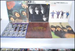 A collection of six vinyl long play LP album records by The Beatles to include Rubber Soul, Love