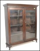 An early 20th Century Edwardian oak glazed bookcas