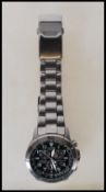 A Citizen Eco Drive WR 200 gentleman's chronograph wrist watch having a black face with three