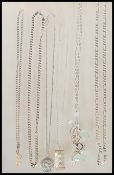 A collection of stamped 925 silver necklaces to include two flat link chains, a St Christopher