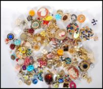 A collection of vintage costume jewellery to include a selection of 60's gold tone brooches,
