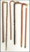 A collection of 20th Century walking canes and sticks to include bamboo, brass horse, handle, duck