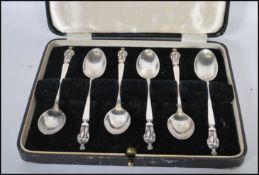 A set of six cased silver hallmarked Apostle teaspoons, the spoons with retailers mark for H & R