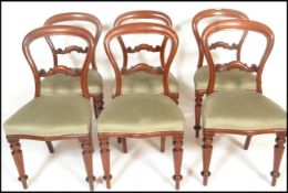 A set of 6 19th century Victorian mahogany balloon back dining chairs. Raised on turned legs with