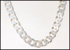 A gentleman's silver large flat link necklace having a lobster clasp. Stamped 925. Measures 20