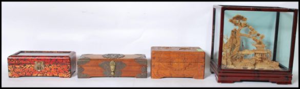 A collection of wooden boxes to include a Japanese box having a red foliate decoration and a cork