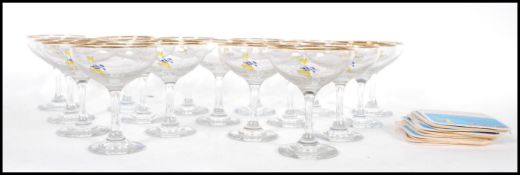 A collection of 17 Babycham glasses having gilt ri