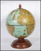 A 20th Century Zoffoli Italian table top drinks cocktail globe set over an oak base hinged top