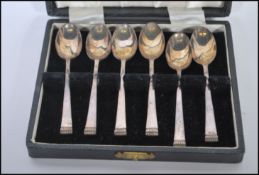 A cased set of six Cooper Brothers & Sons silver hallmarked tea spoons having gadrooned finials.