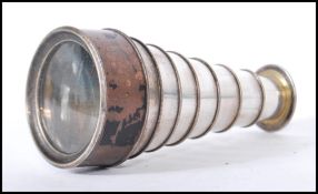 An early 20th / late 19th Century silver plated pocket spyglass monocular telescope, having eight